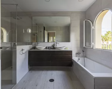 A bathroom with a twin sink.